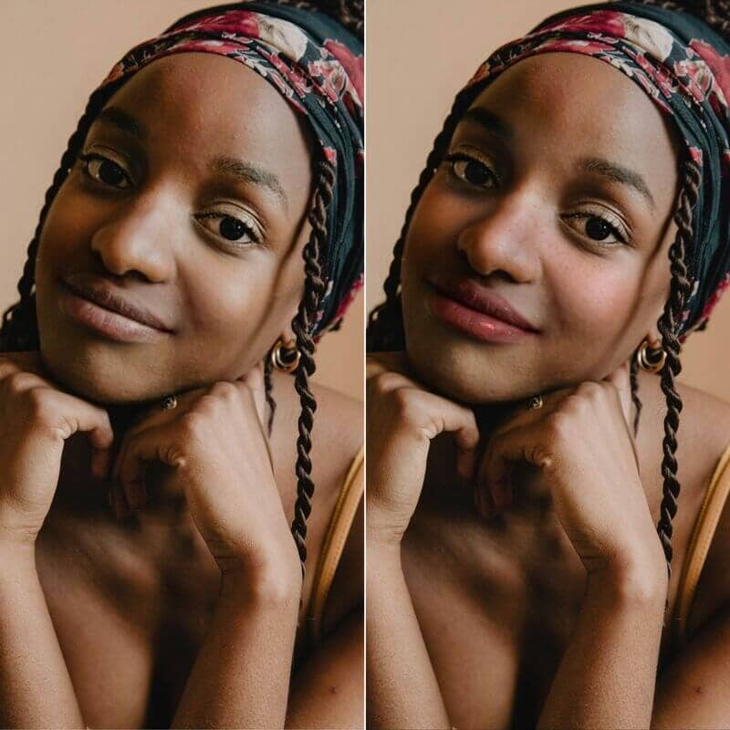 Woman with braids and headband smiling into the camera