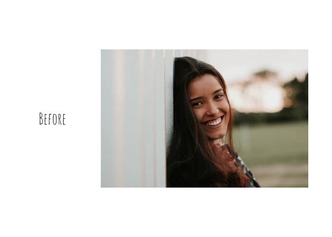 photo of a smiling woman leaning against a wall