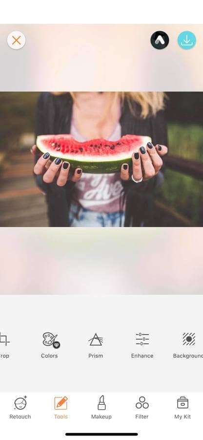 hands holding a watermelon