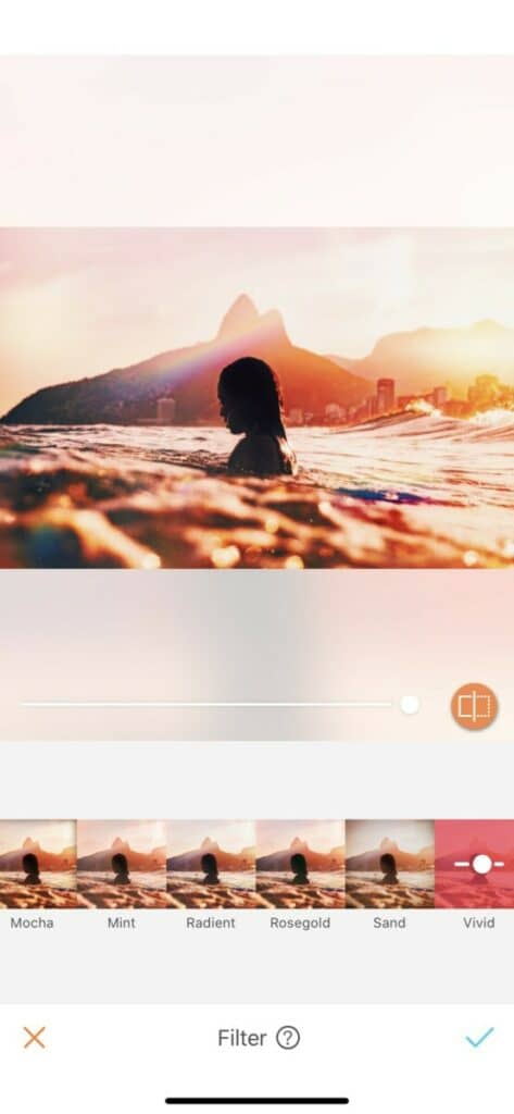 silhouette of a woman in the ocean at sunset