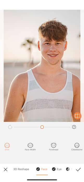 young man in white and grey tank top at the beach