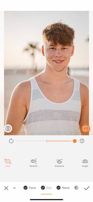 young man in white and grey tank top at the beach