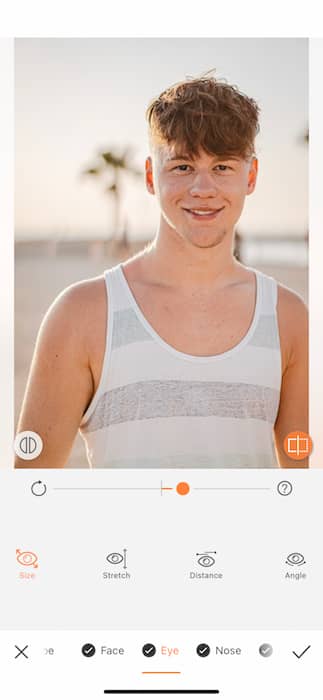 young man in white and grey tank top at the beach