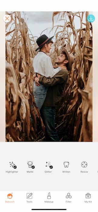 smiling couple embracing in a corn field