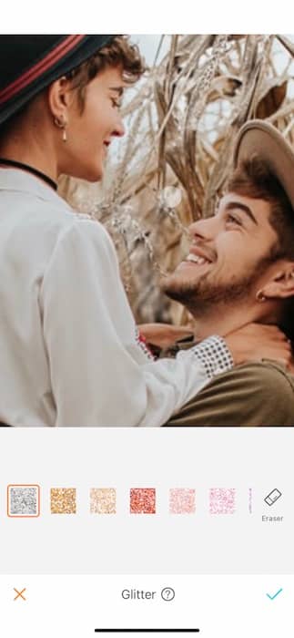 smiling couple embracing in a corn field