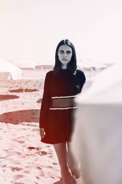 A black and white picture of a woman in a beach with the Gradual Filter