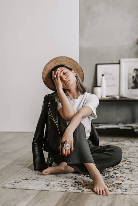 Picture of an Asian woman sitting in her house