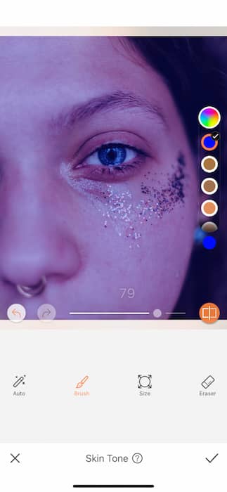 It's an image of a white girl, with blue eyes and glitter in her eyes, being edited with AirBrush App.