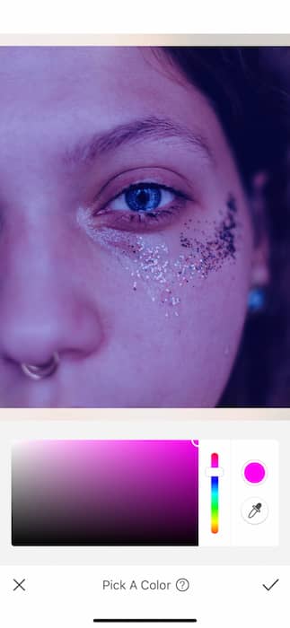 It's an image of a white girl, with blue eyes and glitter in her eyes, being edited with AirBrush App.