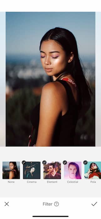 Picture of a woman posing and looking down being edited by AirBrush