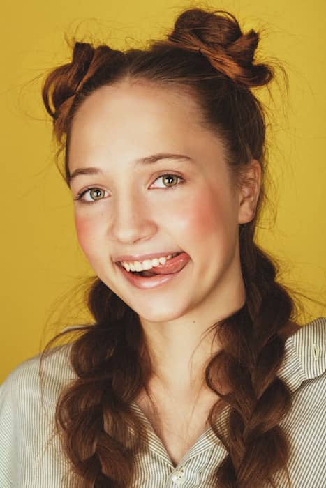 Picture of a woman biting her tongue being edited by AirBrush