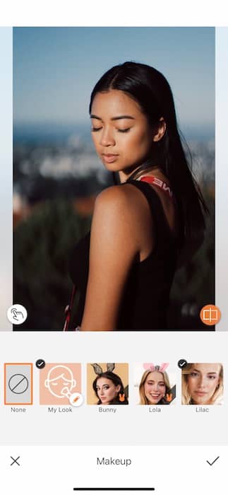 Picture of a woman posing and looking down being edited by AirBrush