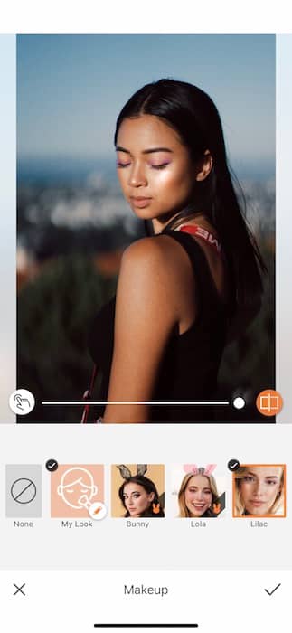 Picture of a woman posing and looking down being edited by AirBrush