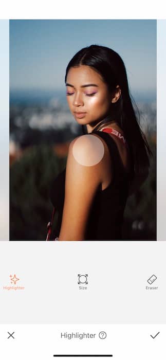 Picture of a woman posing and looking down being edited by AirBrush