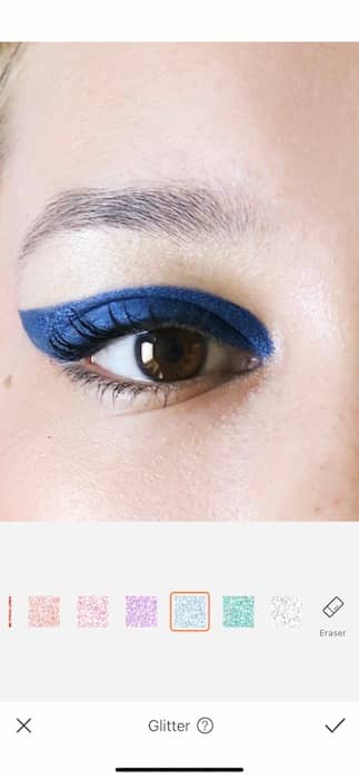 closeup of brown eye with blue eyeliner