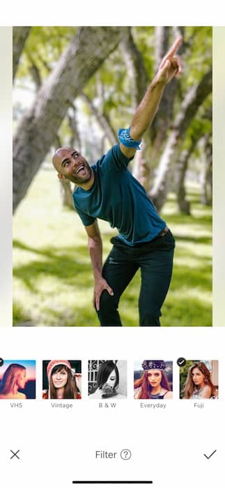 a black man pointing to the sky