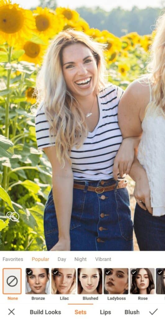 smiling woman in a sunflower field