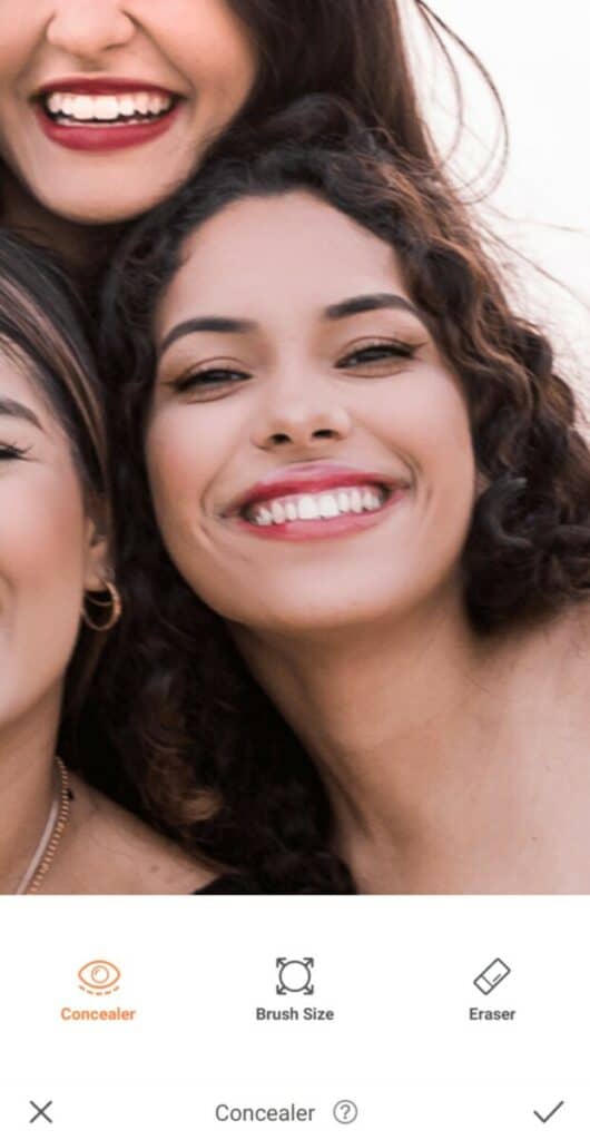 closeup of a smiling woman with dark hair