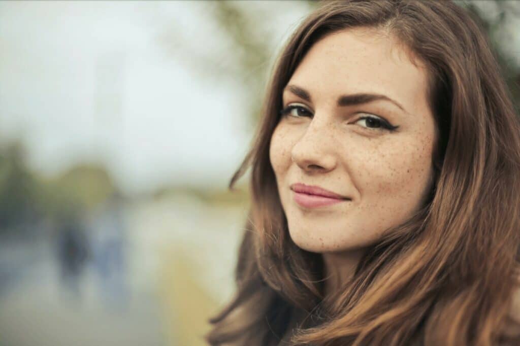 closeup of a smiling brunette woman