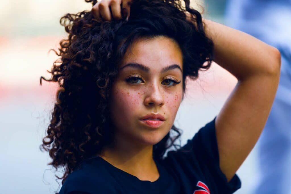 woman with dark hair wearing a black t-shirt