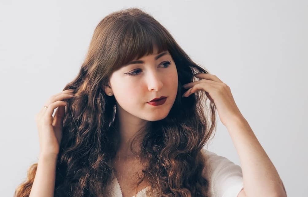 Woman with long hair and bangs