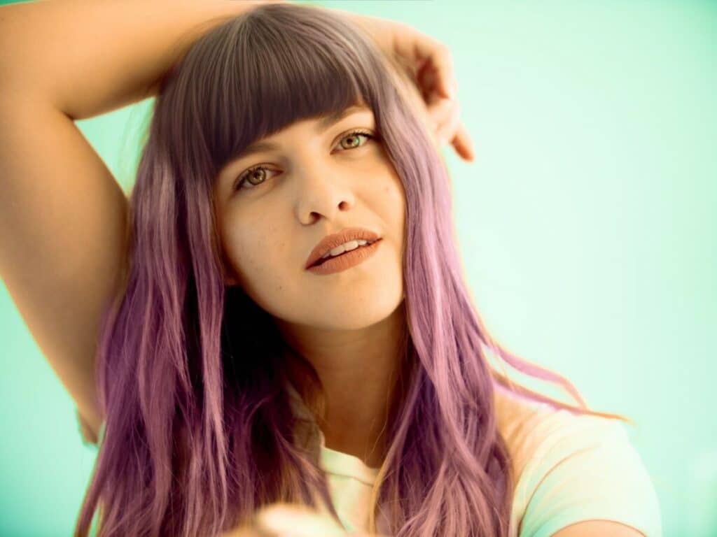 Woman with purple hair and bangs