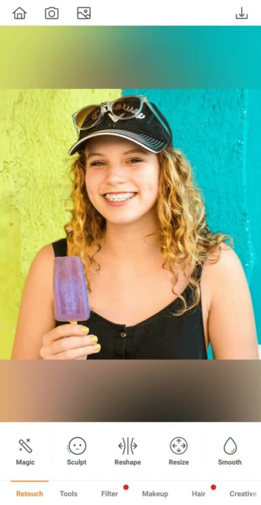 blonde woman holding a lolly