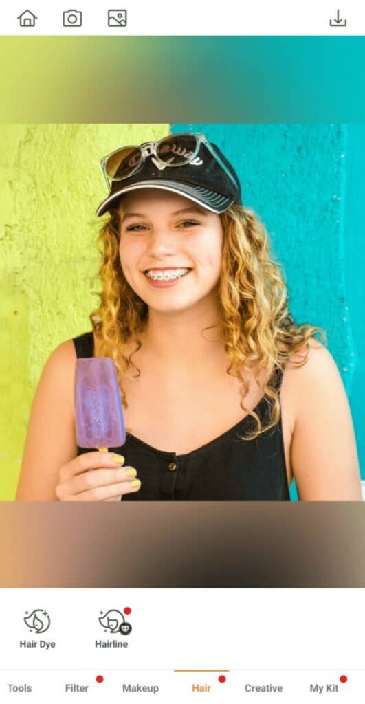 blonde woman holding a lolly