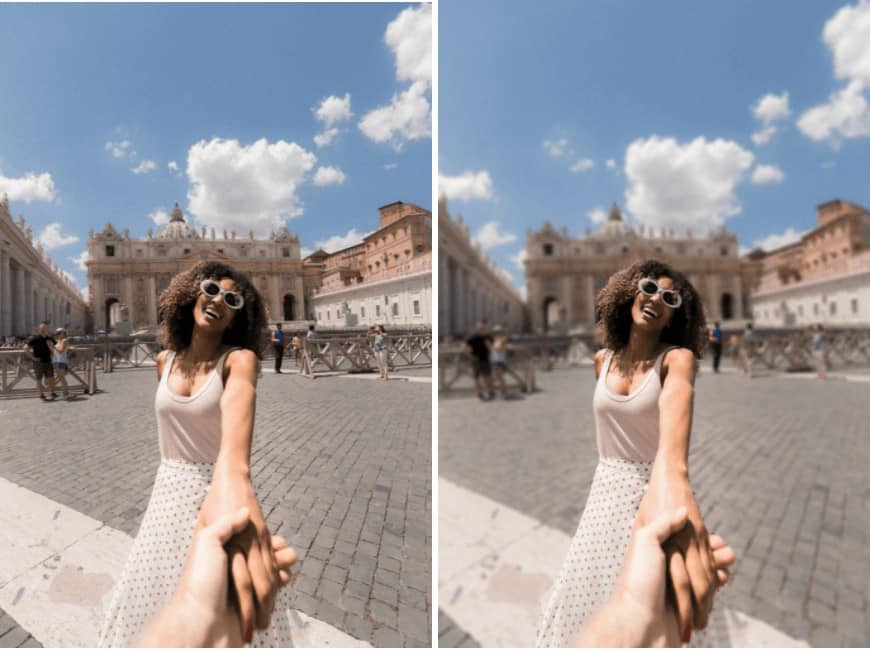 laughing woman standing in front of a popular attraction with travel photobombers in the background