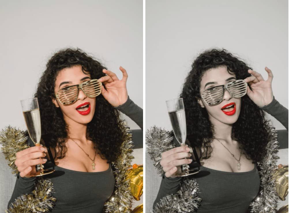 woman wearing a green dress celebrating with champagne