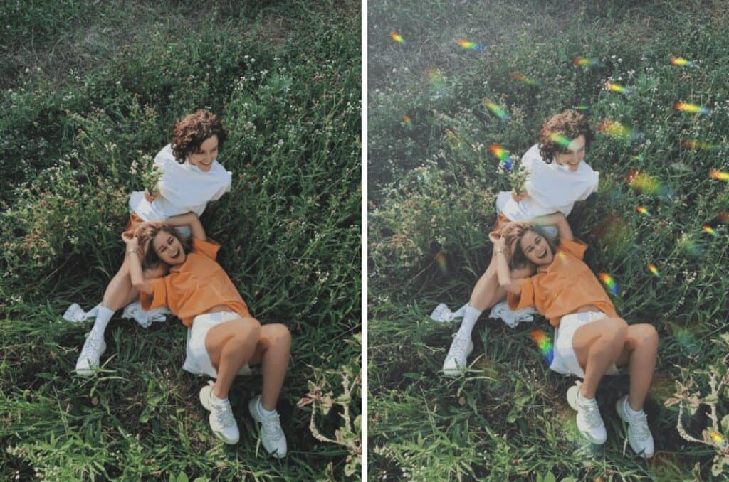 two girls laying in a field of grass smiling