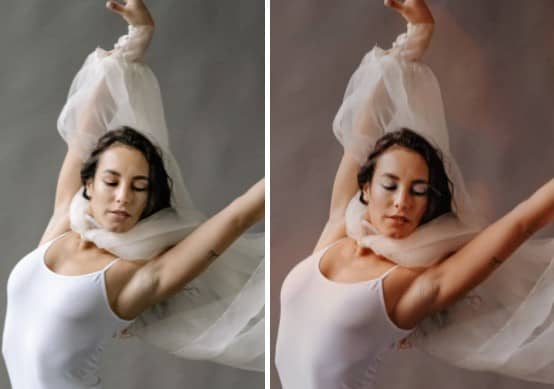 Woman in white dancing with her hands in the air