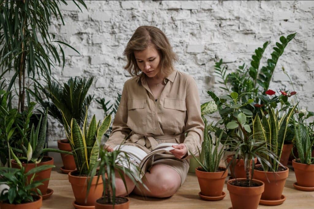 woman sitting on the floor reading