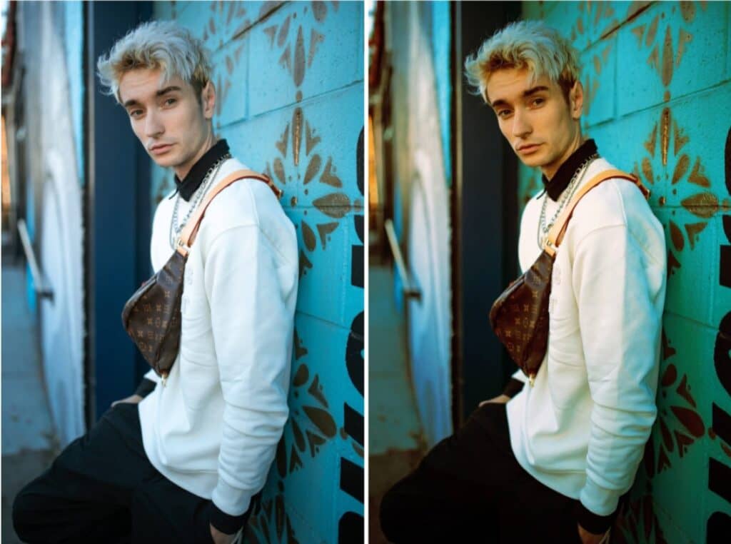 man leaning against blue wall