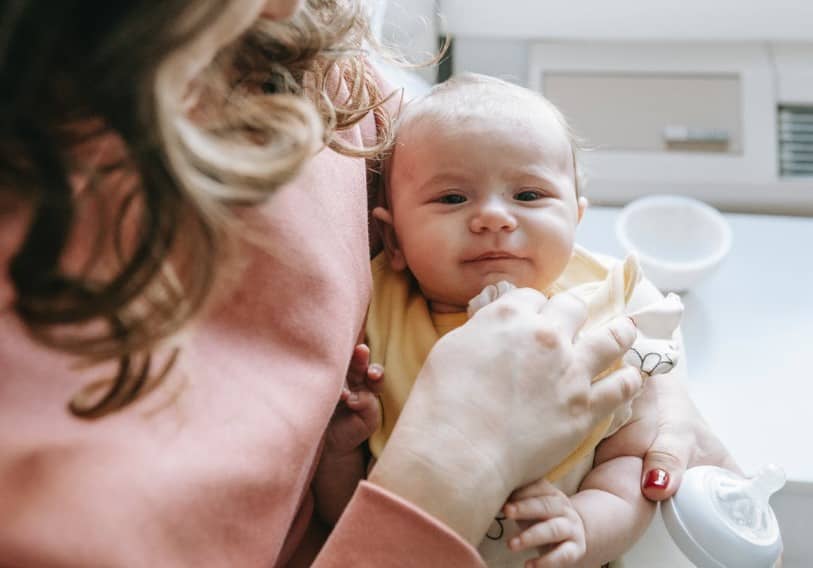 woman holding baby