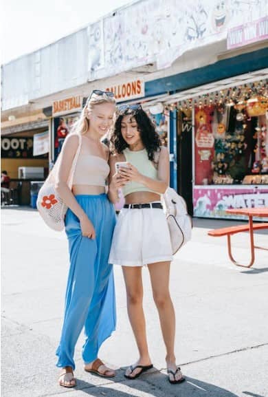 two women looking at a phone