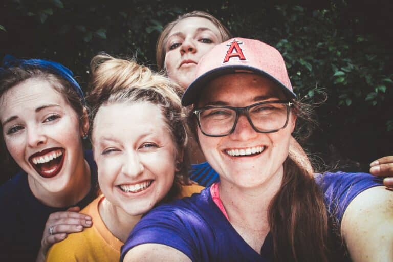 friends laughing and taking a selfie